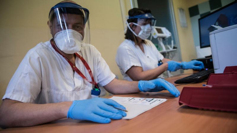 Staff running coronavirus tests in Turin, Italy