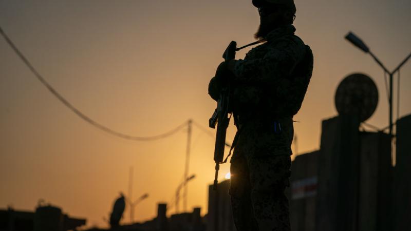 Soldier at dusk at Camp Taji, August 2019