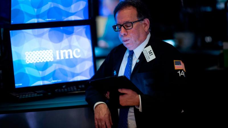 A trader at the New York Stock Exchange