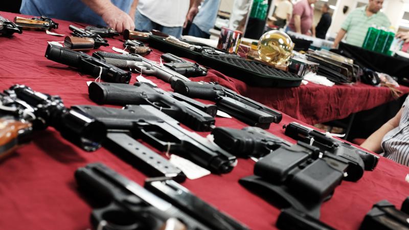 A table of merchandise at a gun sale