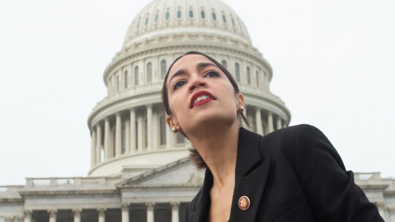 Representative Alexandra Ocasio-Cortez in front of the U.S. Capitol building