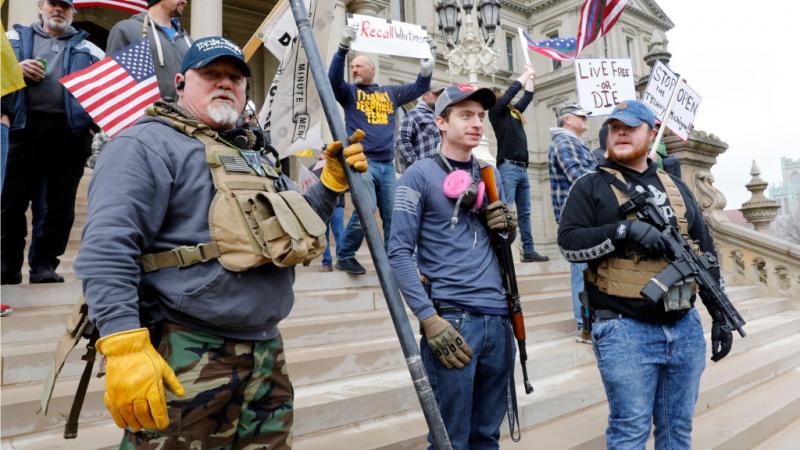 Protestors at the "Michiganders Against Excessive Quarantine" demonstration at the State Capitol in Lansing