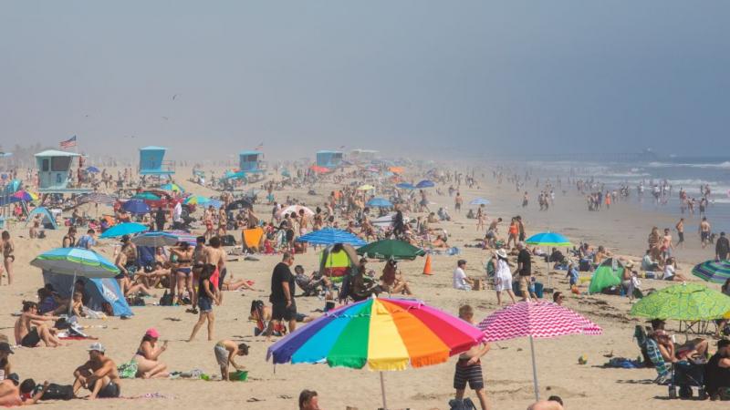Californians flock to Huntington Beach on April 25, 2020 as a heatwave spreads across SoCal