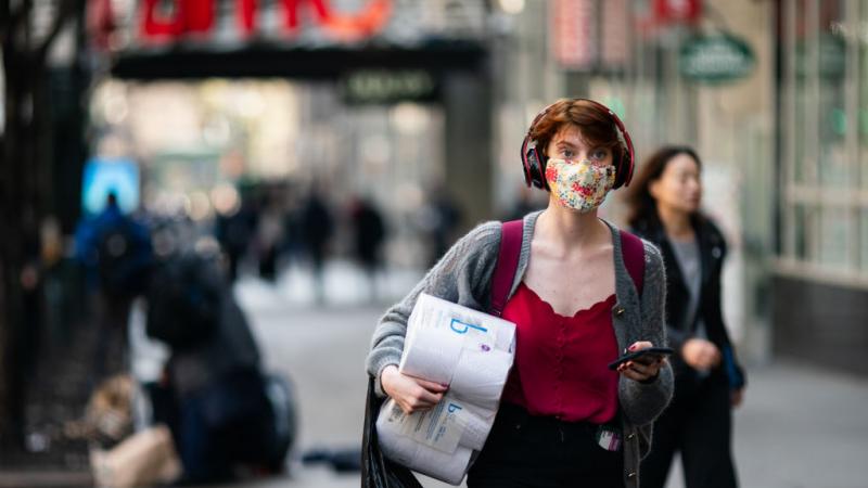 A woman wearing a mask in New York City