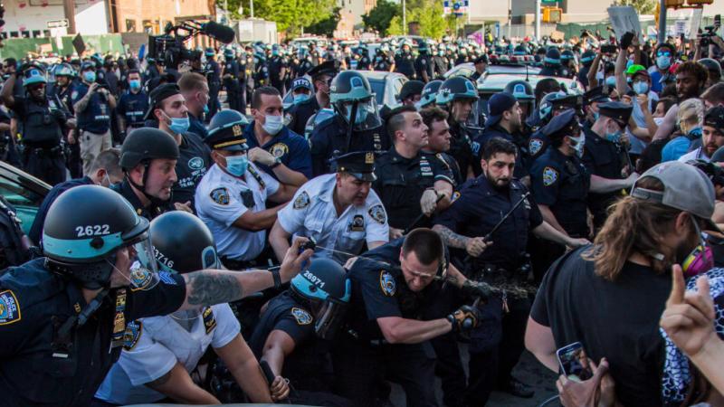 Police and protestors clash in the Brooklyn borough of New York City on May 30, 2020