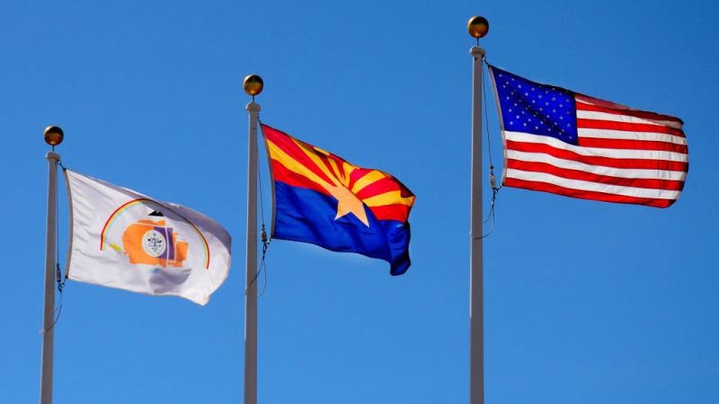 Navajo Nation flag, Arizona flag and U.S. flag in 2017