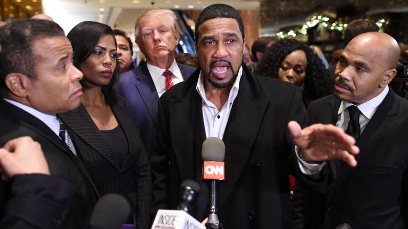  Donald Trump(3rd-L) arrives to speaks to the press with Rev. Darrell Scott(C), senior pastor of the New Spirit Revival Center in Cleveland Heights after meeting with African American pastors at Trump Tower in New York November 30 ,2015. 
