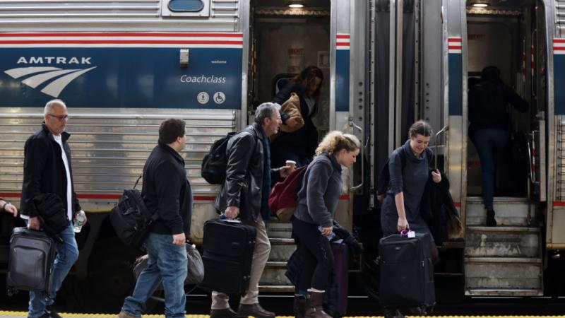 Travelers board an Amtrak train in Nov. of 2019