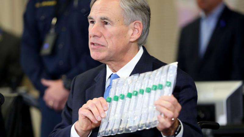 Texas Gov. Greg Abbot displays coronavirus tests