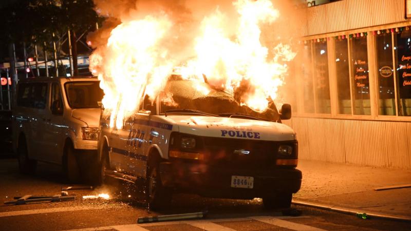 A New York Police van on fire