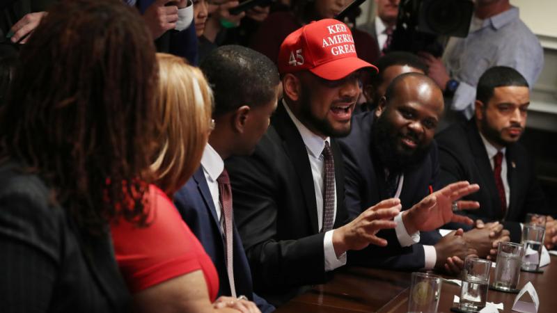 David Harris Jr. wears a "Keep America Great" hat in February 2020
