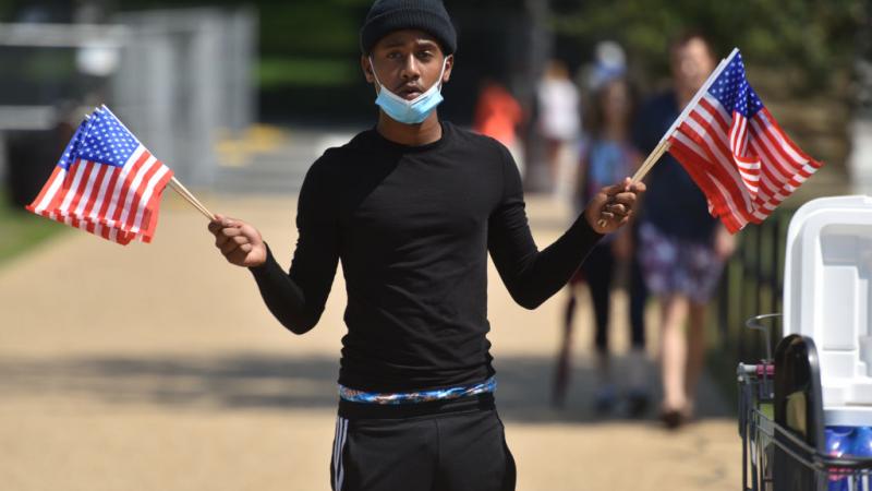 Man holding American flags