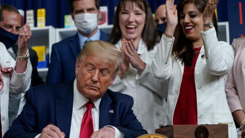 President Donald Trump signs executive orders on prescription drug prices in the South Court Auditorium at the White House on July 24, 2020 in Washington, DC. 
