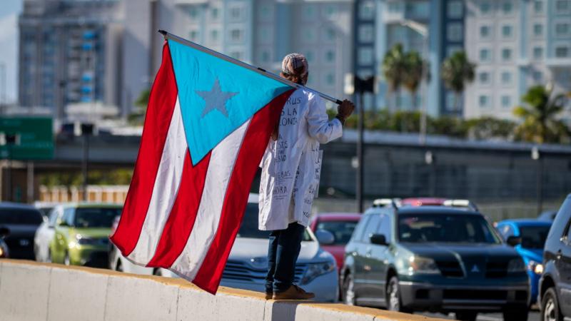 Protestors in Puerto Rico demand the airport be shut down amid a spike in coronavirus cases