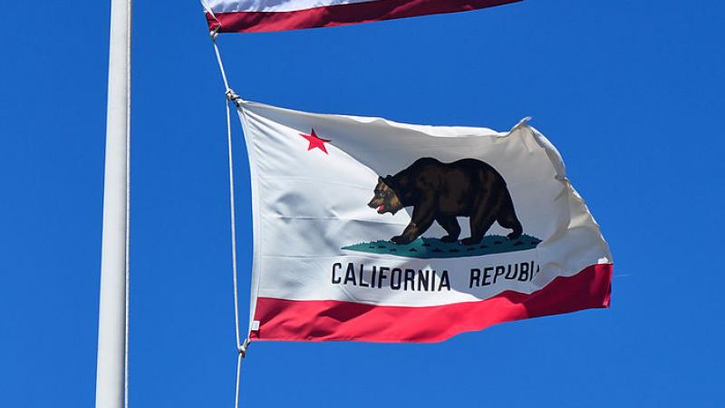 U.S. flag and California flag flying in 2013