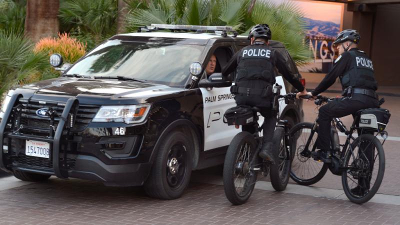 Police officers speaking to each other in Palm Springs, California in 2019