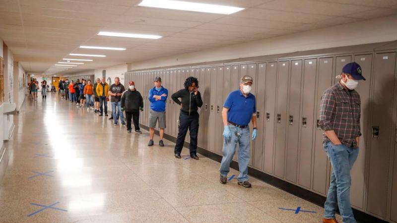 People in line in Wisconsin in April 2020 to vote in a Democratic presidential primary