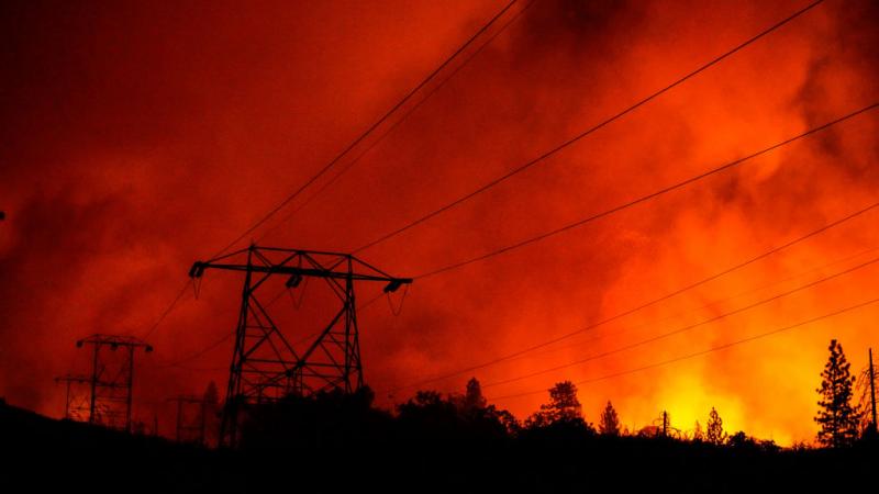Wildfire burns power lines in California