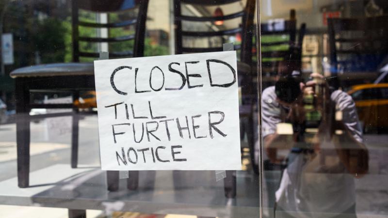 Sign posted reads "closed till further notice."