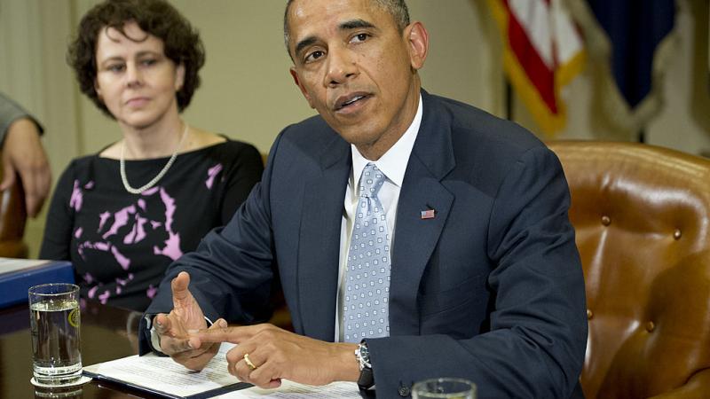 President Obama and Cecilia Muñoz in 2013