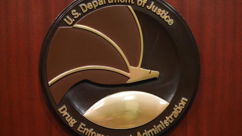 Drug Enforcement Administration seal on a lecturn in 2013
