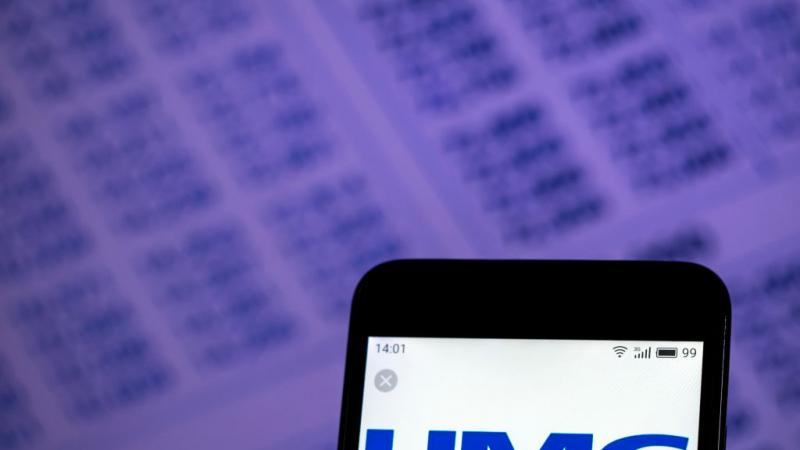 Photo illustration of UMC logo displayed on phone screen