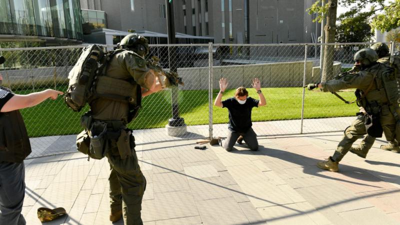 Police detain Matthew Doloff in Denver, CO, Oct. 10