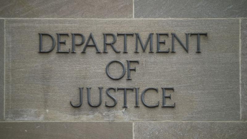 Justice Department sign on DOJ building in Washington D.C. in 2019