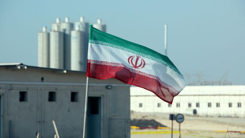 An Iranian flag near Iran's Bushehr nuclear power plant