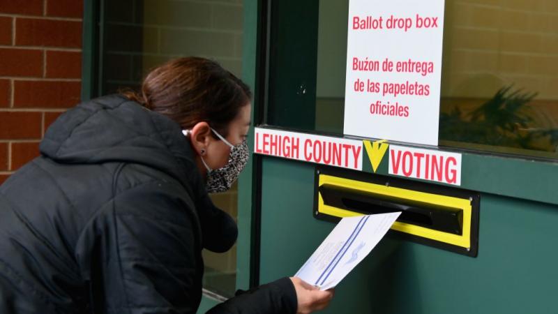 Voter dropping off ballot in Pennsylvania on Oct. 29, 2020