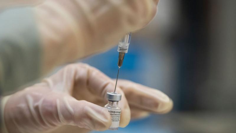 Healthcare worker preparing COVID-19 vaccine doses in Oregon on Dec. 16, 2020