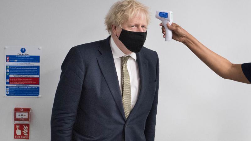 British Prime Minister Boris Johnson having his temperature taken on Jan. 4, 2020
