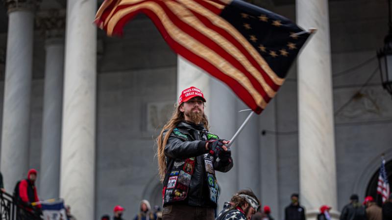 A flag-waving participant in the Capitol demonstration, Jan. 6