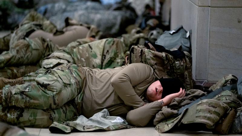 Members of the National Guard sleep in the U.S. Capitol
