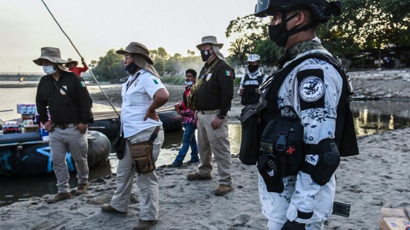 Mexican agents patrol the border with Guatemala