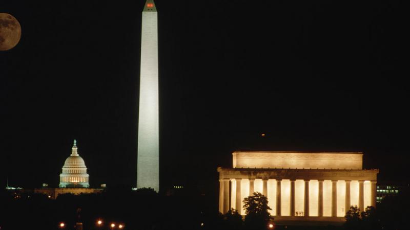 Washington Monument with U.S. Capitol behind and Lincoln Memorial to right.