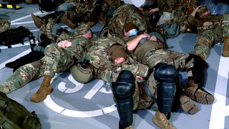 New Hampshire National Guard stage inside a Washington, D.C. parking garage
