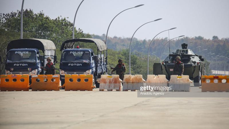 Soldiers and police block the road in Myanmar on February 1, 2021