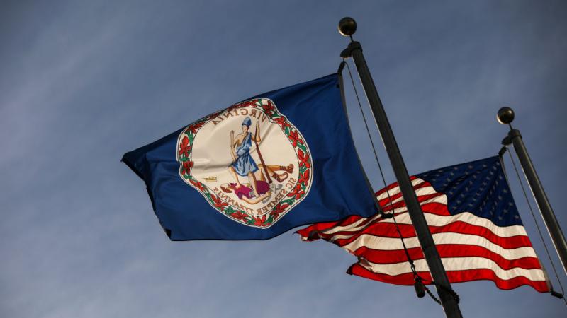 Virginia state flag and American flag on Feb. 9, 2019