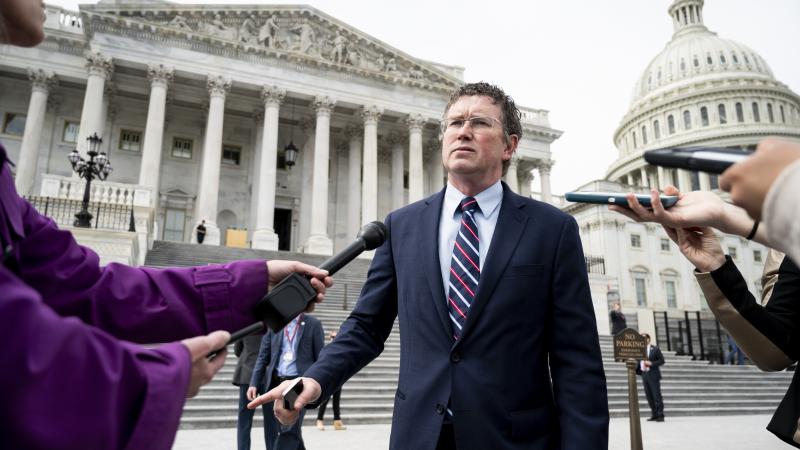 Rep. Thomas Massie, R-Ky., stops to speak with reporters as he leaves the Capitol after the Coronavirus Aid, Relief, and Economic Security Act was passed in the House on Friday, March 27, 2020.