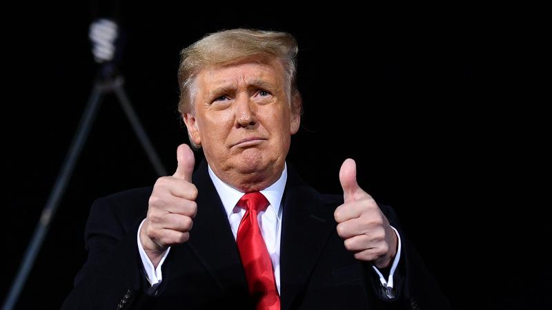 US President Donald Trump gives two thumbs up during a rally in support of Republican incumbent senators Kelly Loeffler and David Perdue ahead of Senate runoff in Dalton, Georgia on January 4, 2021.