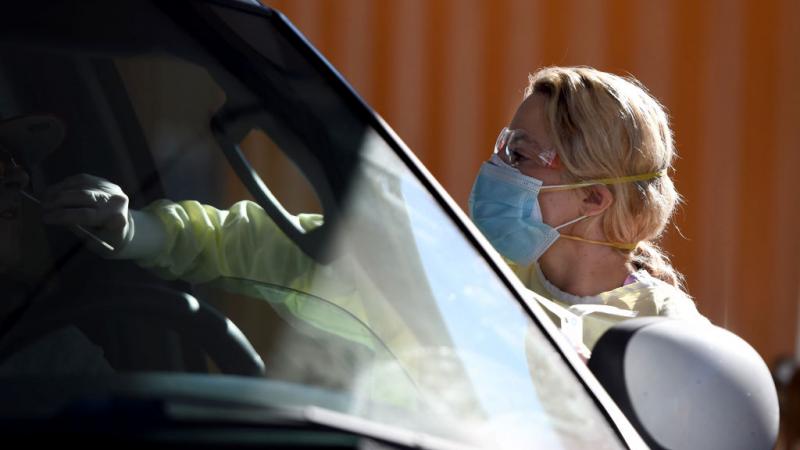 A healthcare worker testing for COVID-19