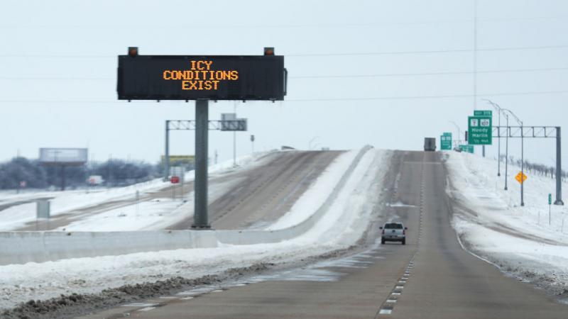 Sign warning about icy conditions in Texas on Feb. 18, 2021