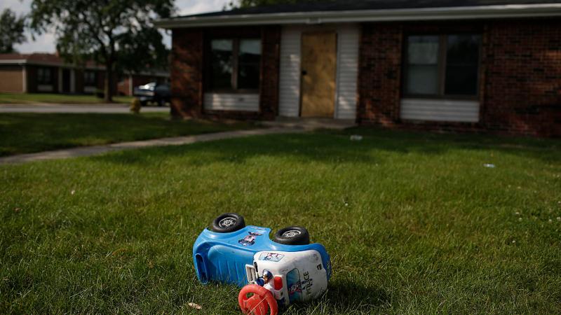 Toy in the grass outside a house at the West Calumet Housing Complex on Sept. 5, 2016