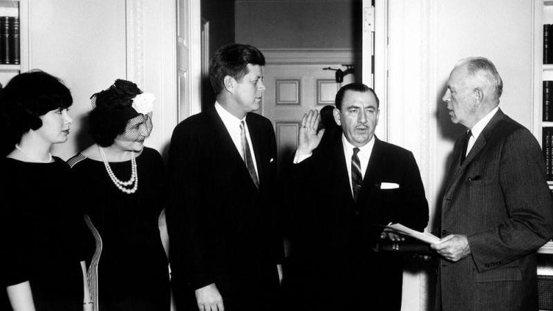 Nancy Pelosi's father is sworn in to a post while his wife, JFK, and a young Nancy look on
