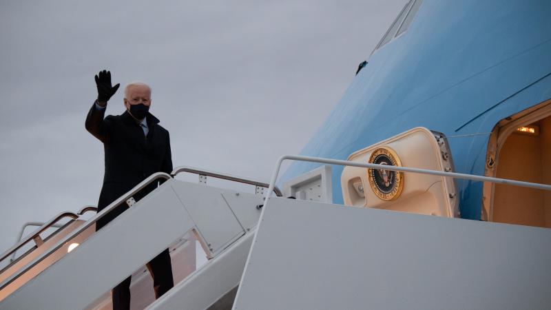 President Joe Biden waving before boarding Air Force One