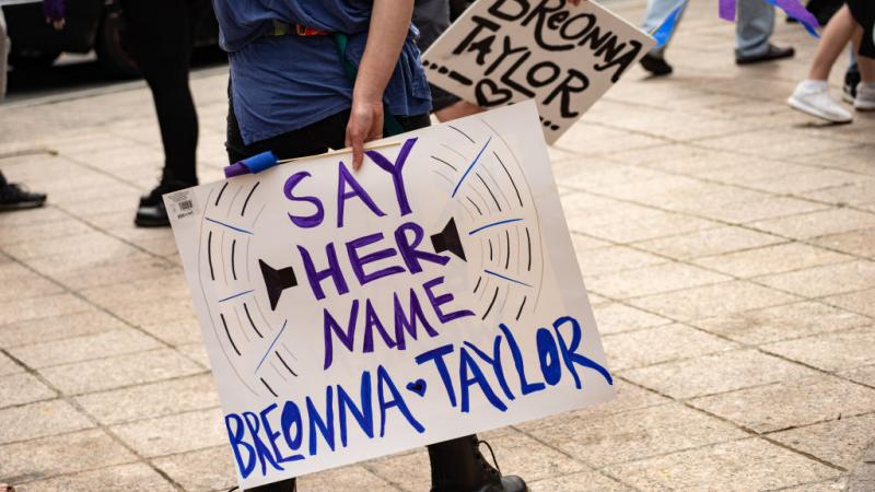 Demonstrators march in Atlanta, Georgia on March 13, 2021 in honor of Breonna Taylor
