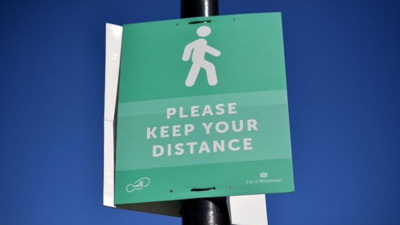A social distancing sign in London, Mar. 2021