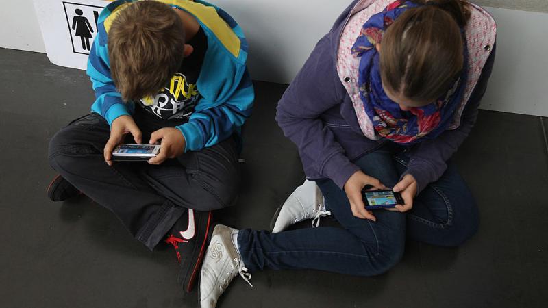 Children using smartphones