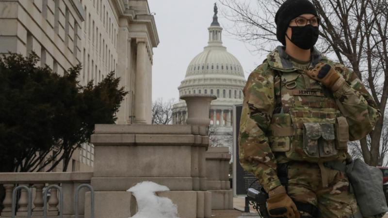 A National Guard soldier stands watch near the U.S. Capitol